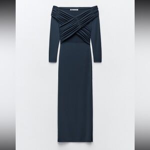 Draped fitted dress.